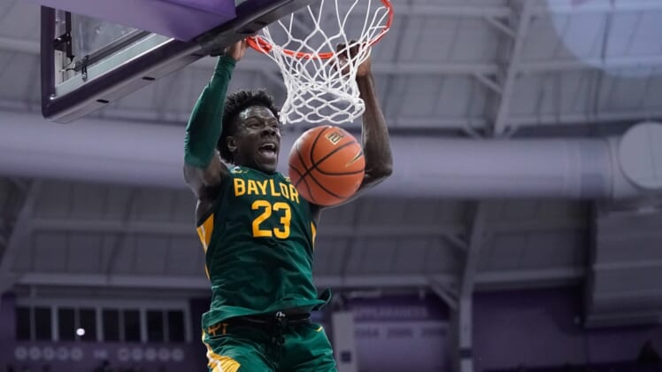 Jan 8, 2022; Fort Worth, Texas, USA;  Baylor Bears forward Jonathan Tchamwa Tchatchoua (23) dunks the ball against the TCU Horned Frogs during the first half at Ed and Rae Schollmaier Arena. Mandatory Credit: Chris Jones-USA TODAY Sports