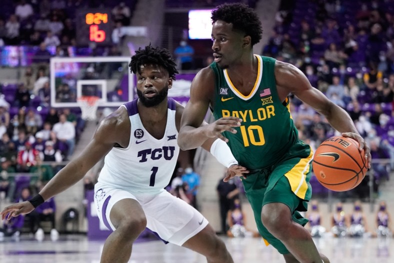 Jan 8, 2022; Fort Worth, Texas, USA;  Baylor Bears guard Adam Flagler (10) drives to the basket past TCU Horned Frogs guard Mike Miles (1) during the second half at Ed and Rae Schollmaier Arena. Mandatory Credit: Chris Jones-USA TODAY Sports