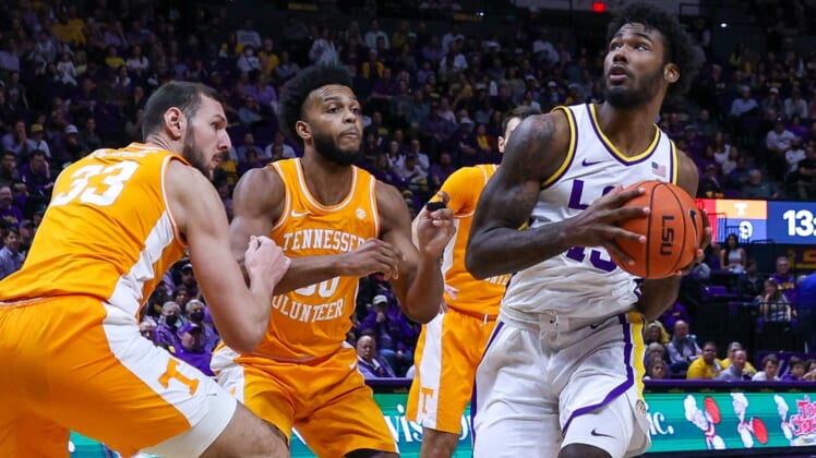 Jan 8, 2022; Baton Rouge, Louisiana, USA;  LSU Tigers forward Tari Eason (13) drives to the basket against Tennessee Volunteers forward Uros Plavsic (33) during the first half at Pete Maravich Assembly Center. Mandatory Credit: Stephen Lew-USA TODAY Sports