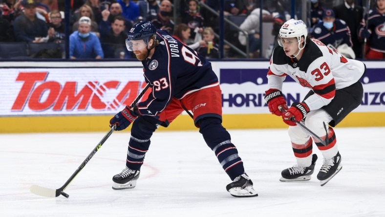 Jan 8, 2022; Columbus, Ohio, USA;  Columbus Blue Jackets right wing Jakub Voracek (93) skates against New Jersey Devils defenseman Ryan Graves (33) in the second period at Nationwide Arena. Mandatory Credit: Aaron Doster-USA TODAY Sports