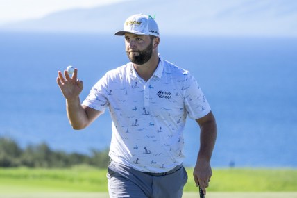 January 8, 2022; Maui, Hawaii, USA; Jon Rahm acknowledges the crowd after making his putt on the 10th hole during the third round of the Sentry Tournament of Champions golf tournament at Kapalua Resort - The Plantation Course. Mandatory Credit: Kyle Terada-USA TODAY Sports