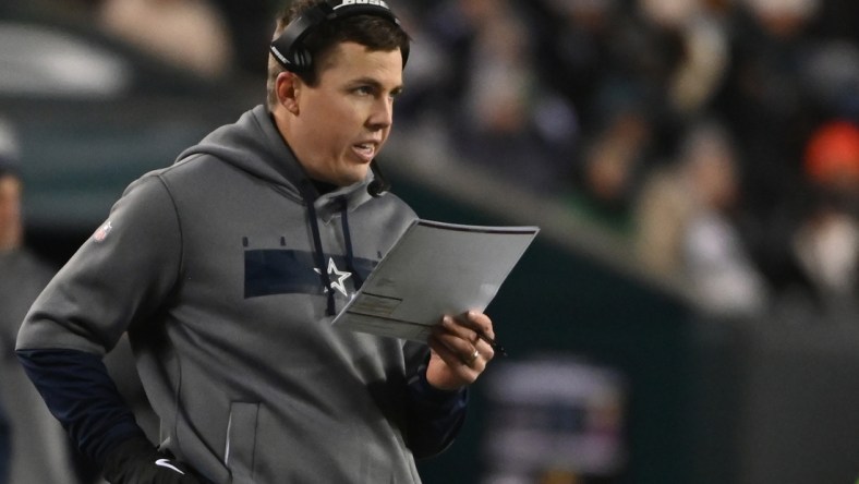 Jan 8, 2022; Philadelphia, Pennsylvania, USA; Dallas Cowboys offensive coordinator Kellen Moore stands on the sidelines against the Philadelphia Eagles during the second quarter at Lincoln Financial Field. Mandatory Credit: Tommy Gilligan-USA TODAY Sports