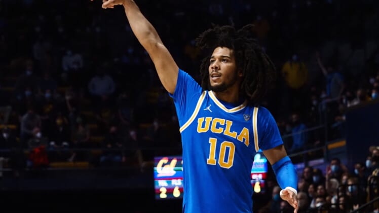 Jan 8, 2022; Berkeley, California, USA; UCLA Bruins guard Tyger Campbell (10) scores a three point basket against the California Golden Bears during the second half at Haas Pavilion. Mandatory Credit: Kelley L Cox-USA TODAY Sports