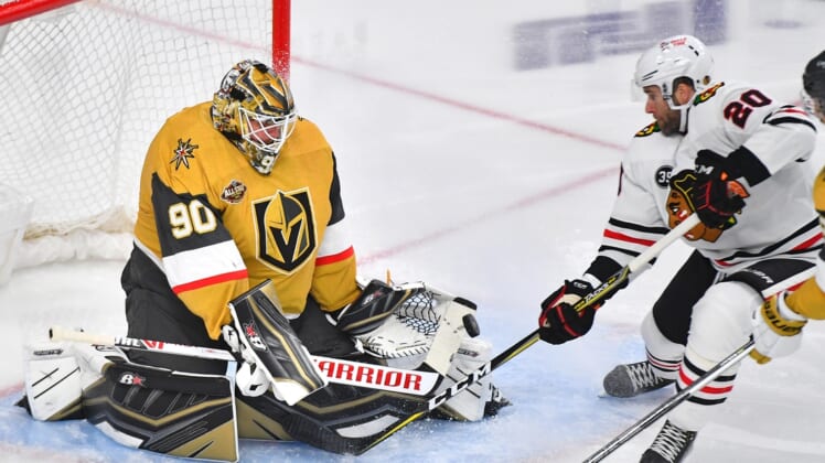 Jan 8, 2022; Las Vegas, Nevada, USA; Vegas Golden Knights goaltender Robin Lehner (90) makes a first period save against Chicago Blackhawks right wing Brett Connolly (20) at T-Mobile Arena. Mandatory Credit: Stephen R. Sylvanie-USA TODAY Sports