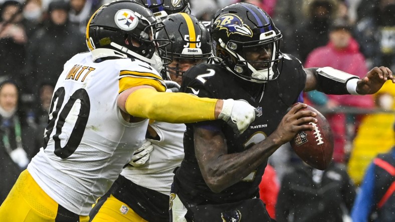 Jan 9, 2022; Baltimore, Maryland, USA;  Pittsburgh Steelers outside linebacker T.J. Watt (90) and outside linebacker Alex Highsmith (56) sack sBaltimore Ravens quarterback Tyler Huntley (2) during the second  quarter at M&T Bank Stadium. Mandatory Credit: Tommy Gilligan-USA TODAY Sports