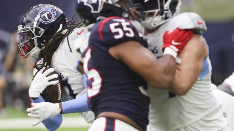 Jan 9, 2022; Houston, Texas, USA; Tennessee Titans running back D'Onta Foreman (7) rushes against the Houston Texans in the second quarter at NRG Stadium. Mandatory Credit: Thomas Shea-USA TODAY Sports