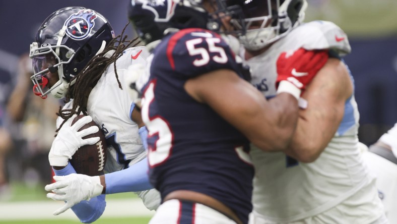 Jan 9, 2022; Houston, Texas, USA; Tennessee Titans running back D'Onta Foreman (7) rushes against the Houston Texans in the second quarter at NRG Stadium. Mandatory Credit: Thomas Shea-USA TODAY Sports