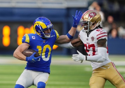 Jan 9, 2022; Inglewood, California, USA; Los Angeles Rams wide receiver Cooper Kupp (10) runs the ball against San Francisco 49ers defensive back Dontae Johnson (27) in the first half at SoFi Stadium. Mandatory Credit: Kirby Lee-USA TODAY Sports