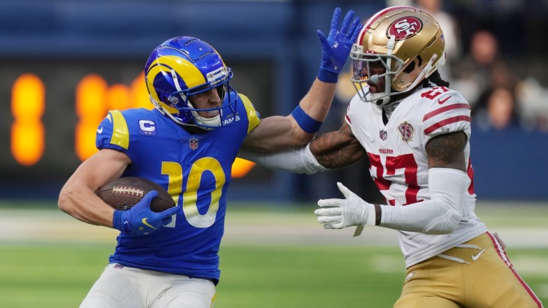 Jan 9, 2022; Inglewood, California, USA; Los Angeles Rams wide receiver Cooper Kupp (10) runs the ball against San Francisco 49ers defensive back Dontae Johnson (27) in the first half at SoFi Stadium. Mandatory Credit: Kirby Lee-USA TODAY Sports