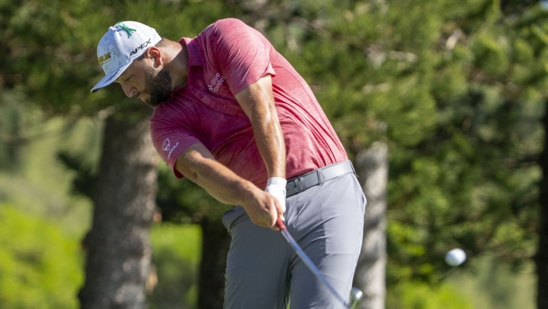 January 9, 2022; Maui, Hawaii, USA; Jon Rahm hits his tee shot on the second hole during the final round of the Sentry Tournament of Champions golf tournament at Kapalua Resort - The Plantation Course. Mandatory Credit: Kyle Terada-USA TODAY Sports