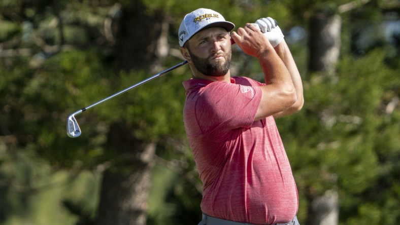 January 9, 2022; Maui, Hawaii, USA; Jon Rahm hits his tee shot on the second hole during the final round of the Sentry Tournament of Champions golf tournament at Kapalua Resort - The Plantation Course. Mandatory Credit: Kyle Terada-USA TODAY Sports