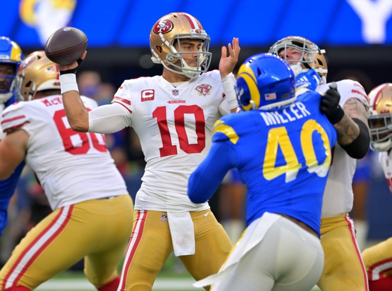 Jan 9, 2022; Inglewood, California, USA;  San Francisco 49ers quarterback Jimmy Garoppolo (10) sets to pass the ball in the first half of the game against the Los Angeles Rams at SoFi Stadium. Mandatory Credit: Jayne Kamin-Oncea-USA TODAY Sports
