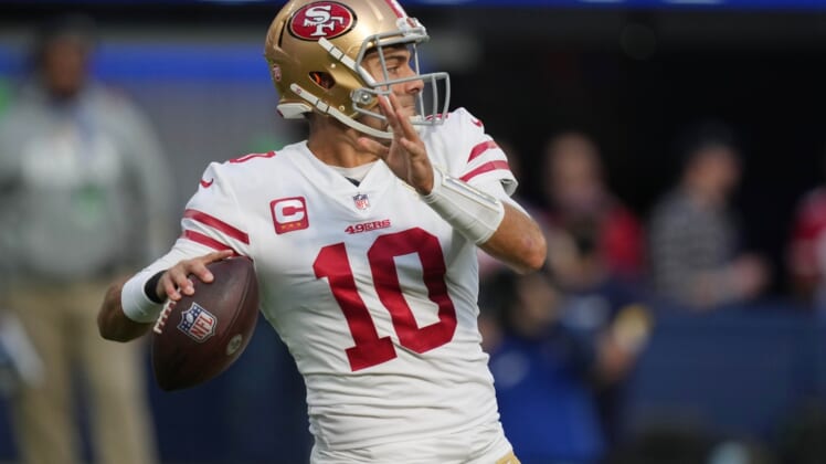 Jan 9, 2022; Inglewood, California, USA; San Francisco 49ers quarterback Jimmy Garoppolo (10) throws a pass against the Los Angeles Rams in the first half at SoFi Stadium. Mandatory Credit: Kirby Lee-USA TODAY Sports
