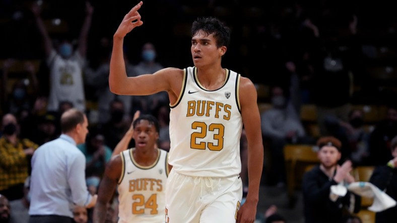 Jan 9, 2022; Boulder, Colorado, USA; Colorado Buffaloes forward Tristan da Silva (23) celebrates his three point score in the first half against the Washington Huskies at the CU Events Center. Mandatory Credit: Ron Chenoy-USA TODAY Sports