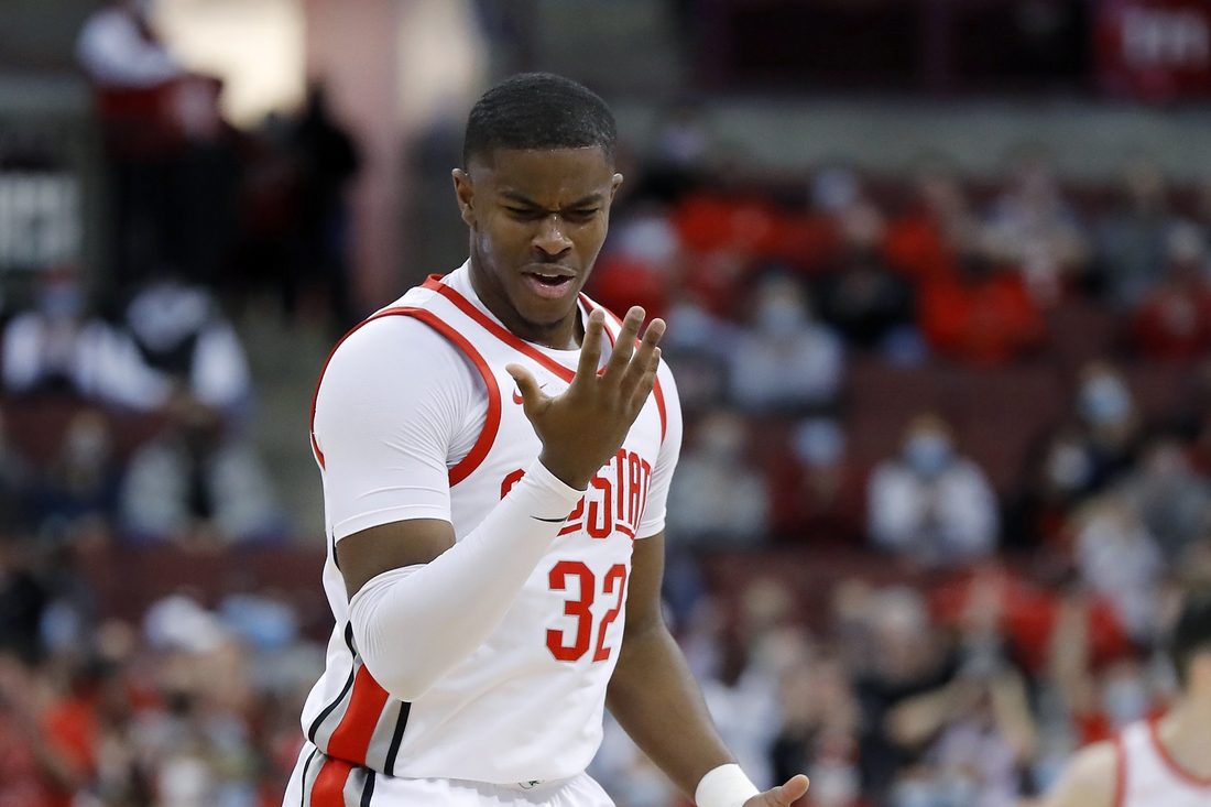 Jan 9, 2022; Columbus, Ohio, USA; Ohio State Buckeyes forward E.J. Liddell (32) celebrates a three point basket during the first half against the Northwestern Wildcats at Value City Arena. Mandatory Credit: Joseph Maiorana-USA TODAY Sports