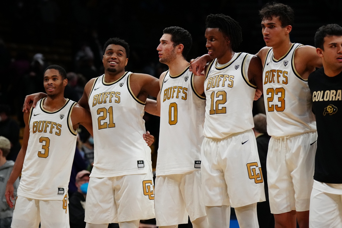 Jan 9, 2022; Boulder, Colorado, USA; Colorado Buffaloes guard Keeshawn Barthelemy (3) and forward Evan Battey (21) and guard Luke O'Brien (0) and forward Jabari Walker (12) and forward Tristan da Silva (23) celebrate defeating the Washington Huskies at the CU Events Center. Mandatory Credit: Ron Chenoy-USA TODAY Sports