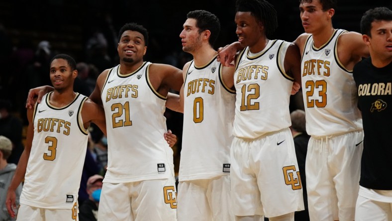 Jan 9, 2022; Boulder, Colorado, USA; Colorado Buffaloes guard Keeshawn Barthelemy (3) and forward Evan Battey (21) and guard Luke O'Brien (0) and forward Jabari Walker (12) and forward Tristan da Silva (23) celebrate defeating the Washington Huskies at the CU Events Center. Mandatory Credit: Ron Chenoy-USA TODAY Sports