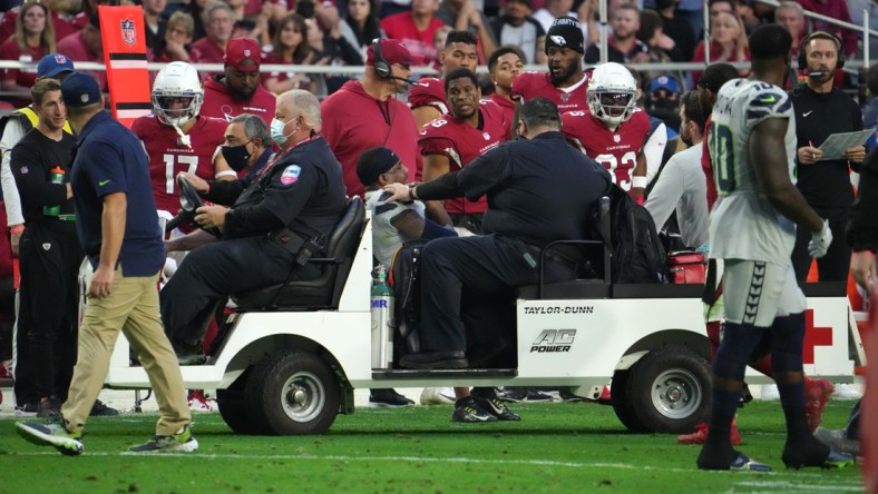 Jan 9, 2022; Glendale, Arizona, USA; Seattle Seahawks free safety Quandre Diggs (6) is carted off the field against the Arizona Cardinals during the second half at State Farm Stadium. Mandatory Credit: Joe Camporeale-USA TODAY Sports