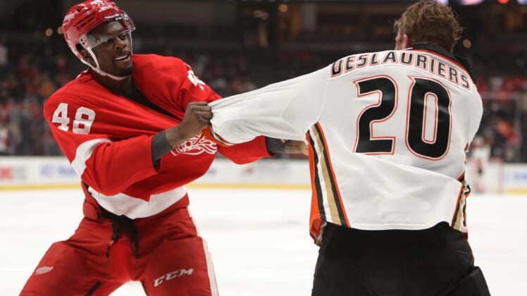 Jan 9, 2022; Anaheim, California, USA; Detroit Red Wings left wing Givani Smith (48) and Anaheim Ducks left wing Nicolas Deslauriers (20) fight during the first period of the NHL game at Honda Center. Mandatory Credit: Kiyoshi Mio-USA TODAY Sports