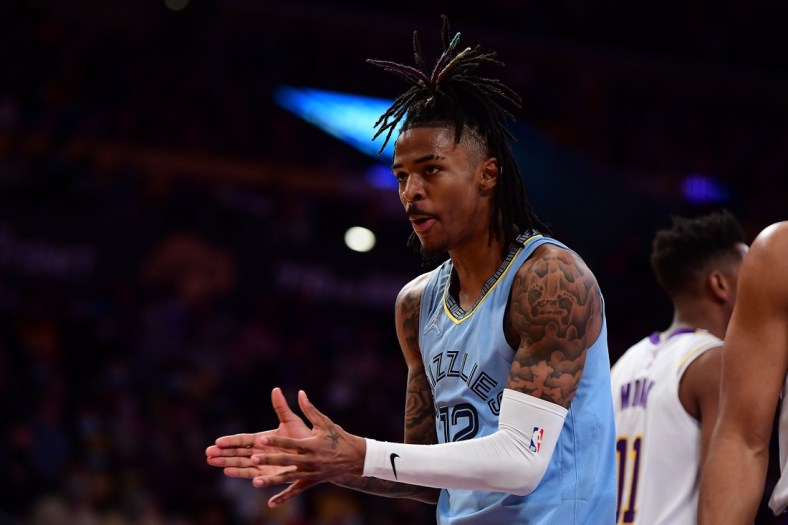 Jan 9, 2022; Los Angeles, California, USA; Memphis Grizzlies guard Ja Morant (12) reacts against the Los Angeles Lakers during the second half at Crypto.com Arena. Mandatory Credit: Gary A. Vasquez-USA TODAY Sports