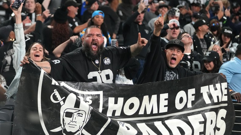 Jan 9, 2022; Paradise, Nevada, USA; Las Vegas Raiders fans celebrate after the Raiders defeated the Los Angeles Chargers 35-32 to earn a playoff spot at Allegiant Stadium. Mandatory Credit: Stephen R. Sylvanie-USA TODAY Sports