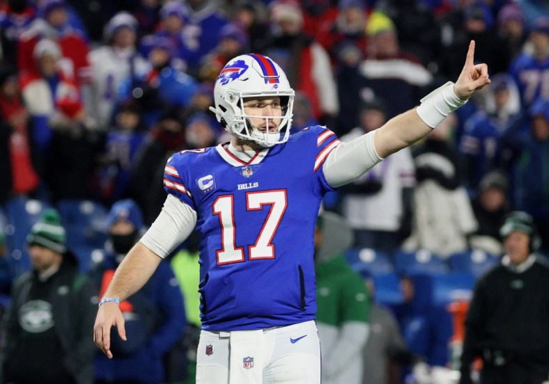 Bills quarterback Josh Allen motifs to the bench for one more play in the final seconds of the first half against the Jets.