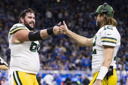 Jan 9, 2022; Detroit, Michigan, USA; Green Bay Packers center Lucas Patrick (62) celebrates with quarterback Aaron Rodgers (12) during the fourth quarter at Ford Field. Mandatory Credit: Raj Mehta-USA TODAY Sports