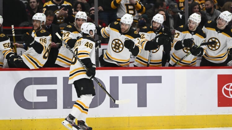 Jan 10, 2022; Washington, District of Columbia, USA; Boston Bruins defenseman Matt Grzelcyk (48) is congratulated by teammates after scoring a goal against the Washington Capitals during the second period at Capital One Arena. Mandatory Credit: Brad Mills-USA TODAY Sports