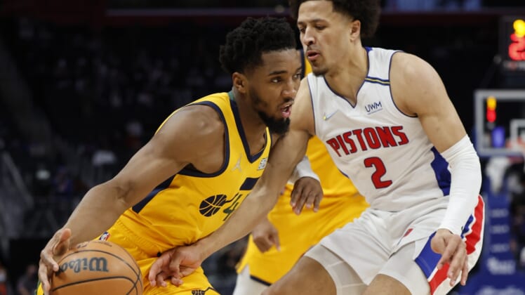Jan 10, 2022; Detroit, Michigan, USA;  Utah Jazz guard Donovan Mitchell (45) dribbles defended by Detroit Pistons guard Cade Cunningham (2) in the second half at Little Caesars Arena. Mandatory Credit: Rick Osentoski-USA TODAY Sports
