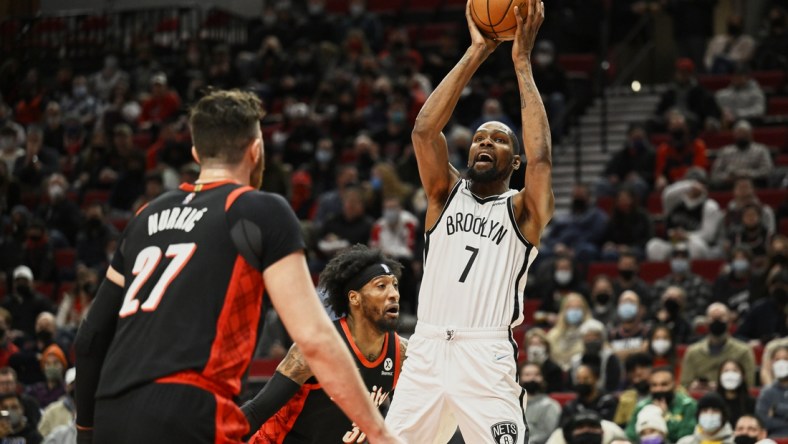 Jan 10, 2022; Portland, Oregon, USA;  Brooklyn Nets forward Kevin Durant (7) shoots a basket during the first half against Portland Trail Blazers forward Robert Covington (33) at Moda Center. Mandatory Credit: Troy Wayrynen-USA TODAY Sports