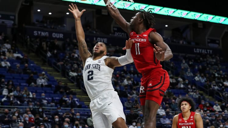 Jan 11, 2022; University Park, Pennsylvania, USA; Rutgers Scarlet Knights center Clifford Omoruyi (11) blocks a shot attempted by Penn State Nittany Lions guard Myles Dread (2) during the first half at Bryce Jordan Center. Mandatory Credit: Matthew OHaren-USA TODAY Sports