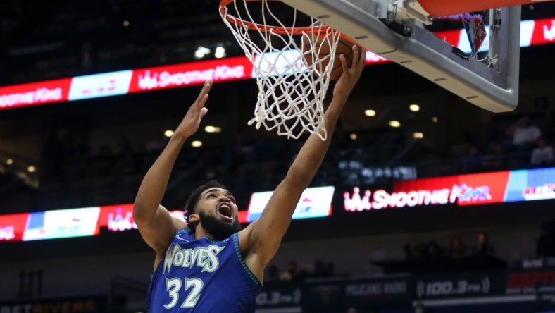 Jan 11, 2022; New Orleans, Louisiana, USA; Minnesota Timberwolves center Karl-Anthony Towns (32) shoots a layup in the first quarter against the New Orleans Pelicans at the Smoothie King Center. Mandatory Credit: Chuck Cook-USA TODAY Sports