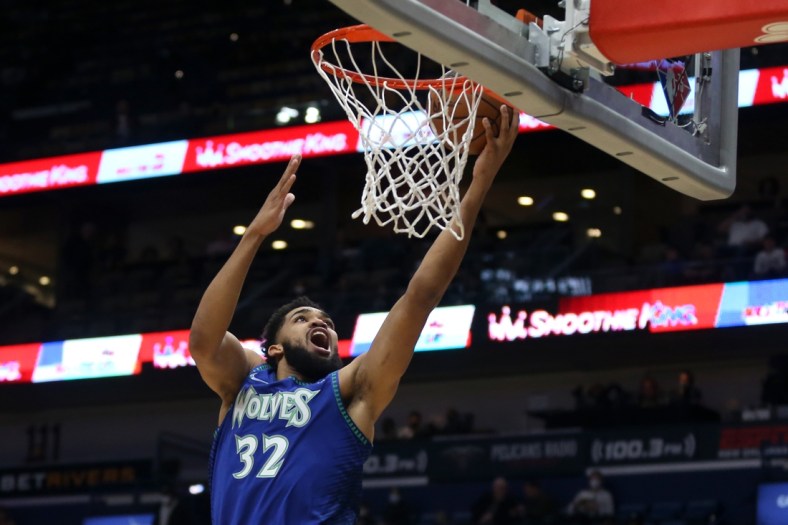Jan 11, 2022; New Orleans, Louisiana, USA; Minnesota Timberwolves center Karl-Anthony Towns (32) shoots a layup in the first quarter against the New Orleans Pelicans at the Smoothie King Center. Mandatory Credit: Chuck Cook-USA TODAY Sports