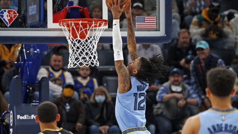 Jan 11, 2022; Memphis, Tennessee, USA; Memphis Grizzles guard Ja Morant (12) dunks the ball during the first half against the Golden State Warriors at FedExForum. Mandatory Credit: Petre Thomas-USA TODAY Sports