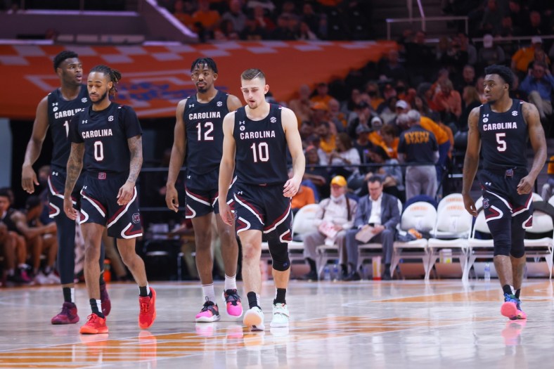 Jan 11, 2022; Knoxville, Tennessee, USA; South Carolina Gamecocks forward Wildens Leveque (15) and guard James Reese V (0) and forward AJ Wilson (12) and guard Erik Stevenson (10) and guard Jermaine Couisnard (5) walk onto the court during the second half against the Tennessee Volunteers at Thompson-Boling Arena. Mandatory Credit: Randy Sartin-USA TODAY Sports