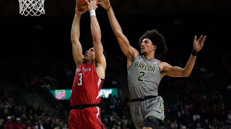 Jan 11, 2022; Waco, Texas, USA;  Texas Tech Red Raiders guard Clarence Nadolny (3) dunks the ball past Baylor Bears guard Kendall Brown (2) during the first half at Ferrell Center. Mandatory Credit: Chris Jones-USA TODAY Sports