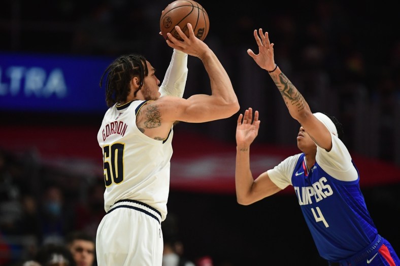 Jan 11, 2022; Los Angeles, California, USA; Denver Nuggets forward Aaron Gordon (50) shoots against Los Angeles Clippers guard Brandon Boston Jr. (4) during the first half at Crypto.com Arena. Mandatory Credit: Gary A. Vasquez-USA TODAY Sports