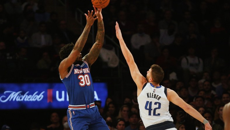 Jan 12, 2022; New York, New York, USA; New York Knicks forward Julius Randle (30) takes a shot while being defended by Dallas Mavericks forward Maxi Kleber (42) during the first half at Madison Square Garden. Mandatory Credit: Andy Marlin-USA TODAY Sports