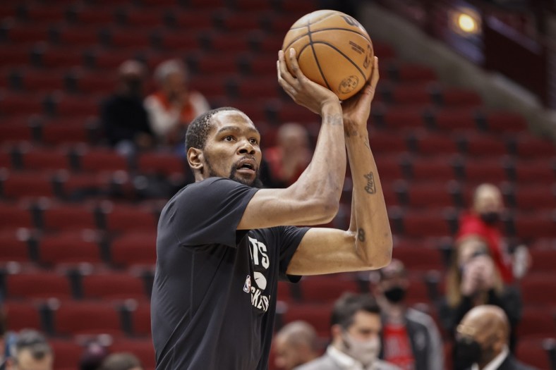 Jan 12, 2022; Chicago, Illinois, USA; Brooklyn Nets forward Kevin Durant (7) warms up before an NBA game against the Chicago Bulls at United Center. Mandatory Credit: Kamil Krzaczynski-USA TODAY Sports