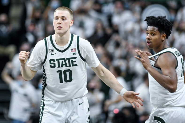 Michigan State's Joey Hauser, left, and A.J. Hoggard celebrate after Hauser's game winning shot against Minnesota during the second half on Wednesday, Jan. 12, 2022, at the Breslin Center in East Lansing.

220112 Msu Minn 231a