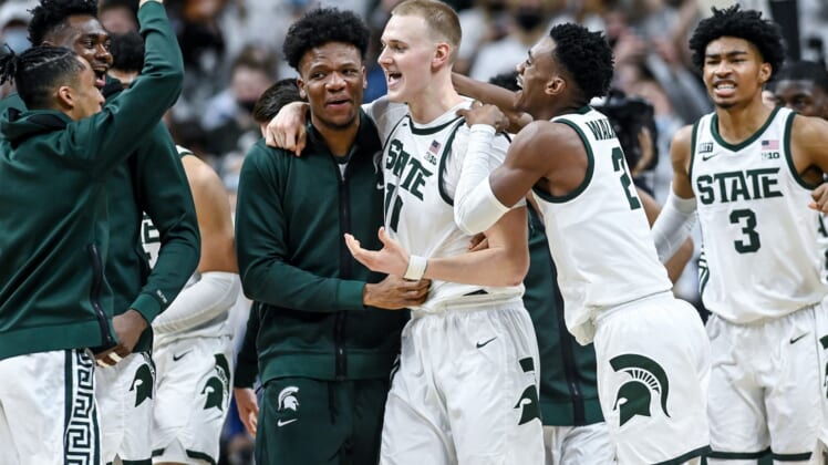 Michigan State's Joey Hauser, center, celebrates after his game winning shot against Minnesota on Wednesday, Jan. 12, 2022, at the Breslin Center in East Lansing.220112 Msu Minn 243a