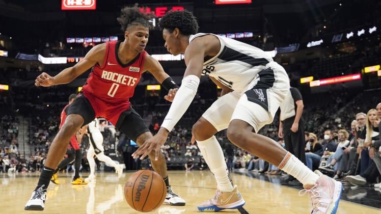 Jan 12, 2022; San Antonio, Texas, USA; San Antonio Spurs guard Joshua Primo (11) dribbles along the baseline while defended by Houston Rockets guard Jalen Green (0) during the first half at AT&T Center. Mandatory Credit: Scott Wachter-USA TODAY Sports