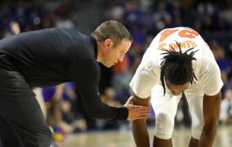 Florida Gators head coach Mike White talks with guard Phlandrous Fleming Jr. (24) during a game against LSU at Exactech Arena in Gainesville Jan 12, 2022.  The Gators dropped their third straight SEC game with this loss to LSU 64-58.Flgai 011122 Gatorsvs Lsu Mbball 14
