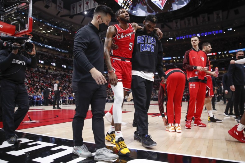 Jan 12, 2022; Chicago, Illinois, USA; Chicago Bulls forward Derrick Jones Jr. (5) leaves the game due to injury during the first half of an NBA game against the Brooklyn Nets at United Center. Mandatory Credit: Kamil Krzaczynski-USA TODAY Sports