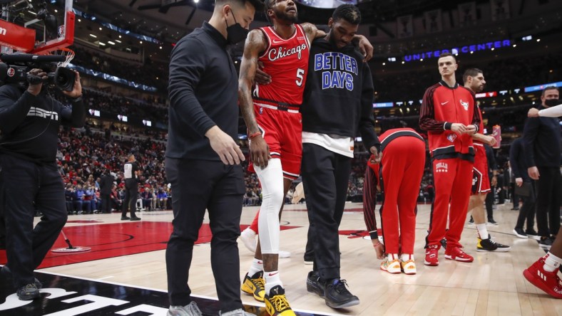 Jan 12, 2022; Chicago, Illinois, USA; Chicago Bulls forward Derrick Jones Jr. (5) leaves the game due to injury during the first half of an NBA game against the Brooklyn Nets at United Center. Mandatory Credit: Kamil Krzaczynski-USA TODAY Sports