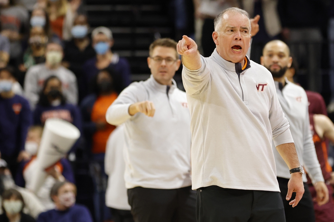 Jan 12, 2022; Charlottesville, Virginia, USA; Virginia Tech Hokies head coach Mike Young reacts from the bench against the Virginia Cavaliers during the second half at John Paul Jones Arena. Mandatory Credit: Geoff Burke-USA TODAY Sports