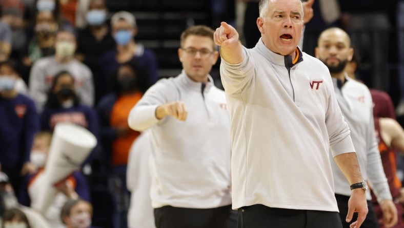 Jan 12, 2022; Charlottesville, Virginia, USA; Virginia Tech Hokies head coach Mike Young reacts from the bench against the Virginia Cavaliers during the second half at John Paul Jones Arena. Mandatory Credit: Geoff Burke-USA TODAY Sports