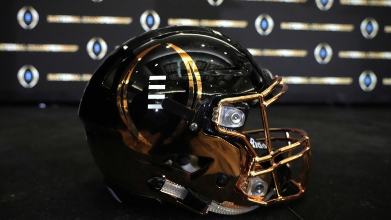 Jan 11, 2022; Indianapolis, Indiana, USA; A detailed view of College Football Playoff National Championship logo helmet at  2022 Indianapolis Host Committee press conference at the JW Marriott. Mandatory Credit: Kirby Lee-USA TODAY Sports