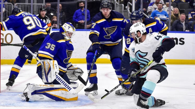 Jan 13, 2022; St. Louis, Missouri, USA;  Seattle Kraken center Colin Blackwell (43) shoots as St. Louis Blues goaltender Ville Husso (35) and defenseman Justin Faulk (72) defend the net during the first period at Enterprise Center. Mandatory Credit: Jeff Curry-USA TODAY Sports