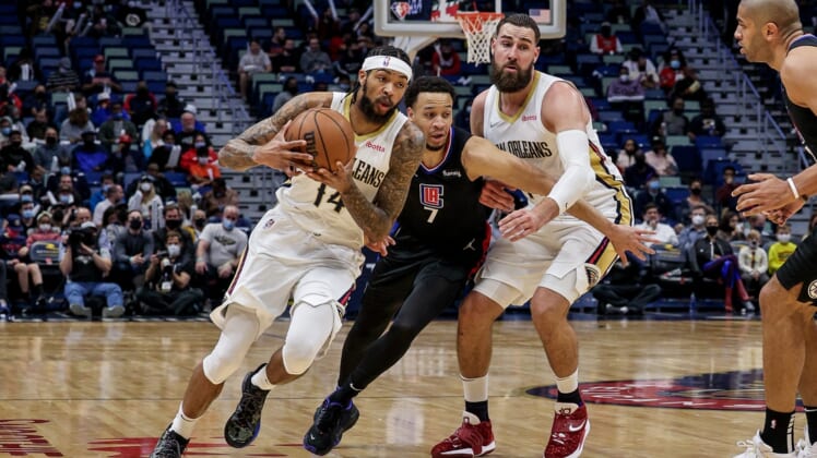 Jan 13, 2022; New Orleans, Louisiana, USA;   New Orleans Pelicans forward Brandon Ingram (14) dribbles against LA Clippers guard Amir Coffey (7) during the first half at the Smoothie King Center. Mandatory Credit: Stephen Lew-USA TODAY Sports